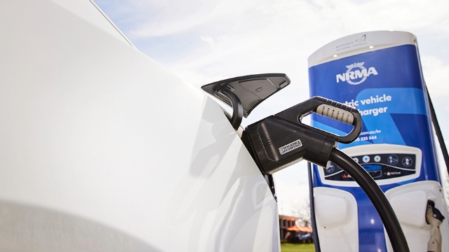 Av EV plugged in at a public charging station