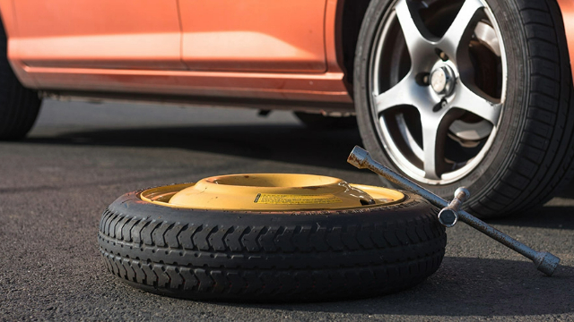 Emergency tyre on the road at breakdown
