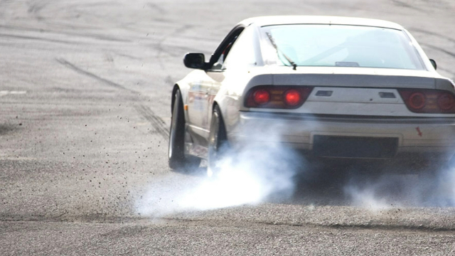 Rear view of a car performing a burn-out Rear view of a car performing a burn-out