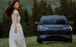 Geely car with a woman looking towards camea