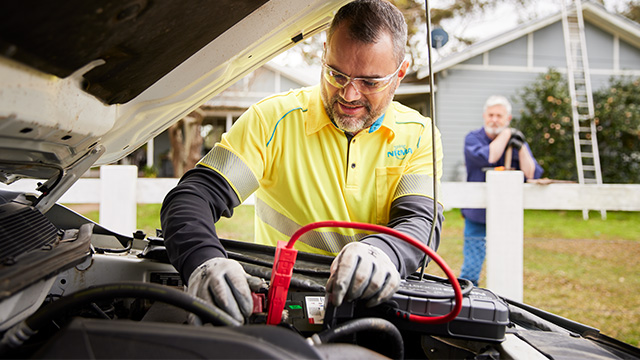 Patrolman working on a battery
