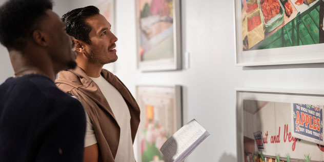 A couple look at art in Campbelltown Gallery