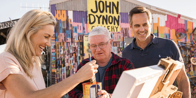 A couple take part in painting at John Dynon Gallery
