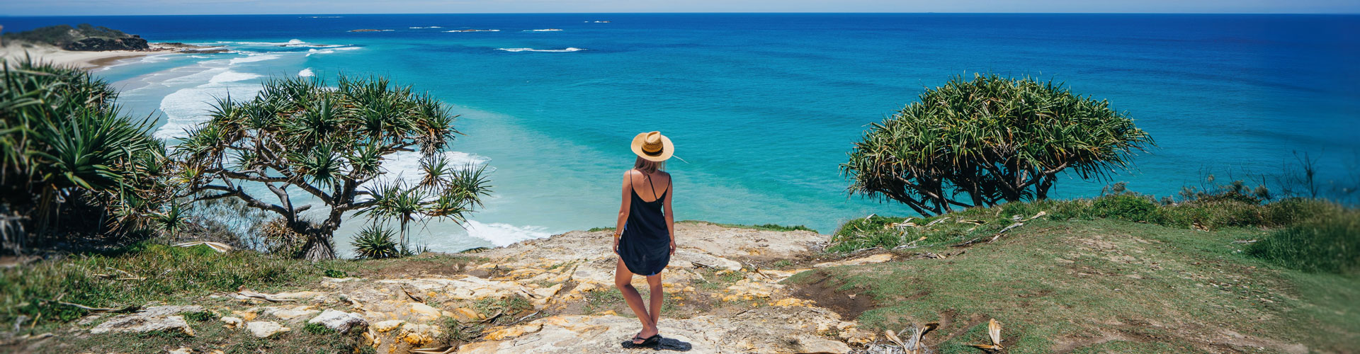 Woman gazing out to ocean at Stradbroke Island