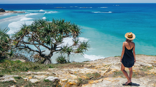 Woman gazing out to ocean at Stradbroke Island