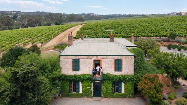 front of the florita wines historic building surrounded by vineyards