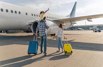 Family walking towards airplane