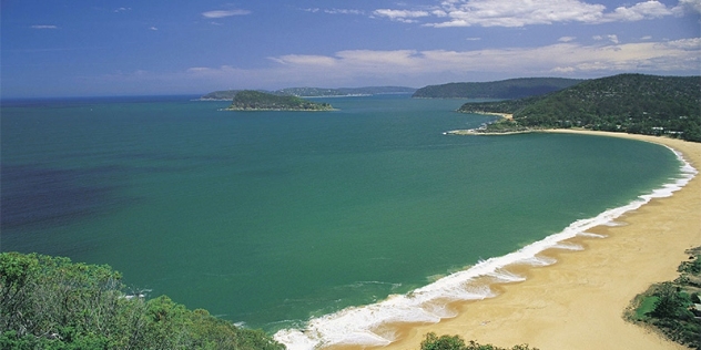 arial view of an empty beach with the coastline in the distance