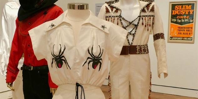 costumes from the 1970s belonging to Slim Newtown and his back-up singers featuring redback spider embroidery for his song redback on the toilet seat