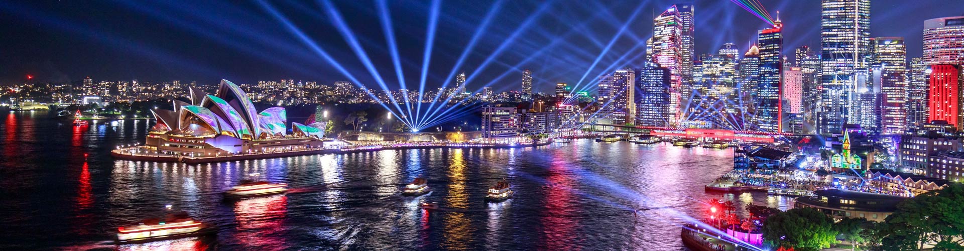 Lights shine into the night sky at the Vivid Festival in Sydney