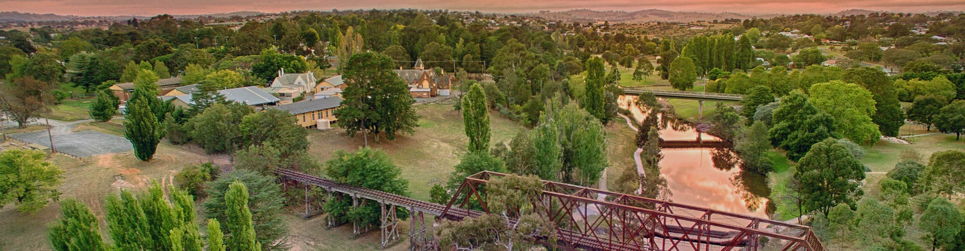 Aerial view of Yass and old train bridge at sunset