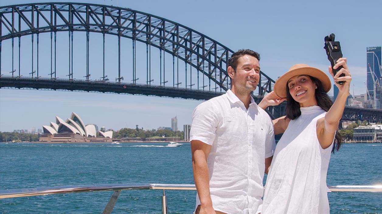 Fantasea Cruising couple overlooking Sydney Harbour Bridge