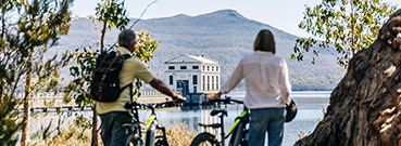 Couple cycling by Pumphouse Point, Tasmania