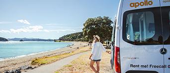 Apollo motorhomes woman driving by beach