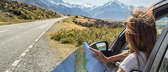 International Driving Permit - woman in car with map