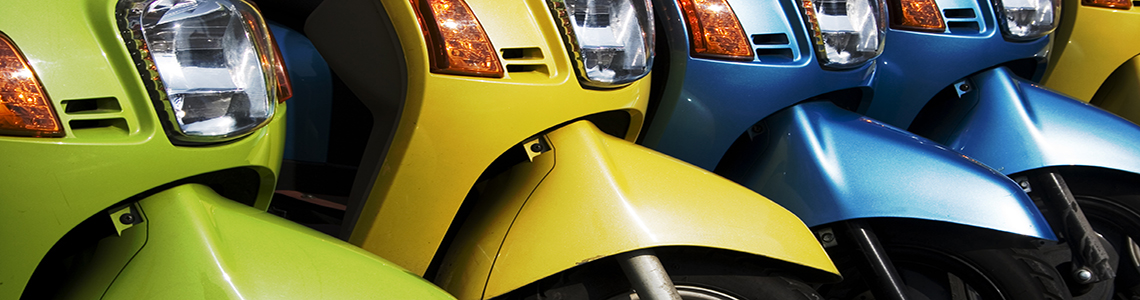 Scooters parked on a street