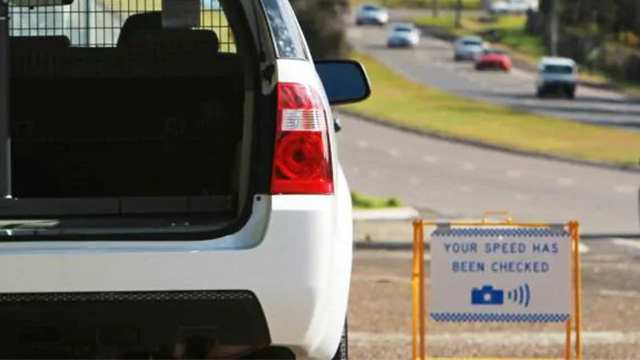 Mobile speed camera warning sign